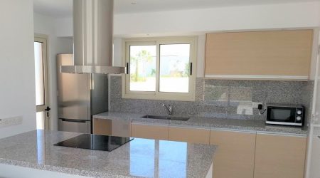 Wooden finish kitchen with grey natural granite worktop
