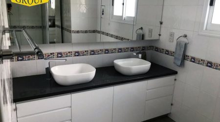 Black granite worktop for twin vanity unit
